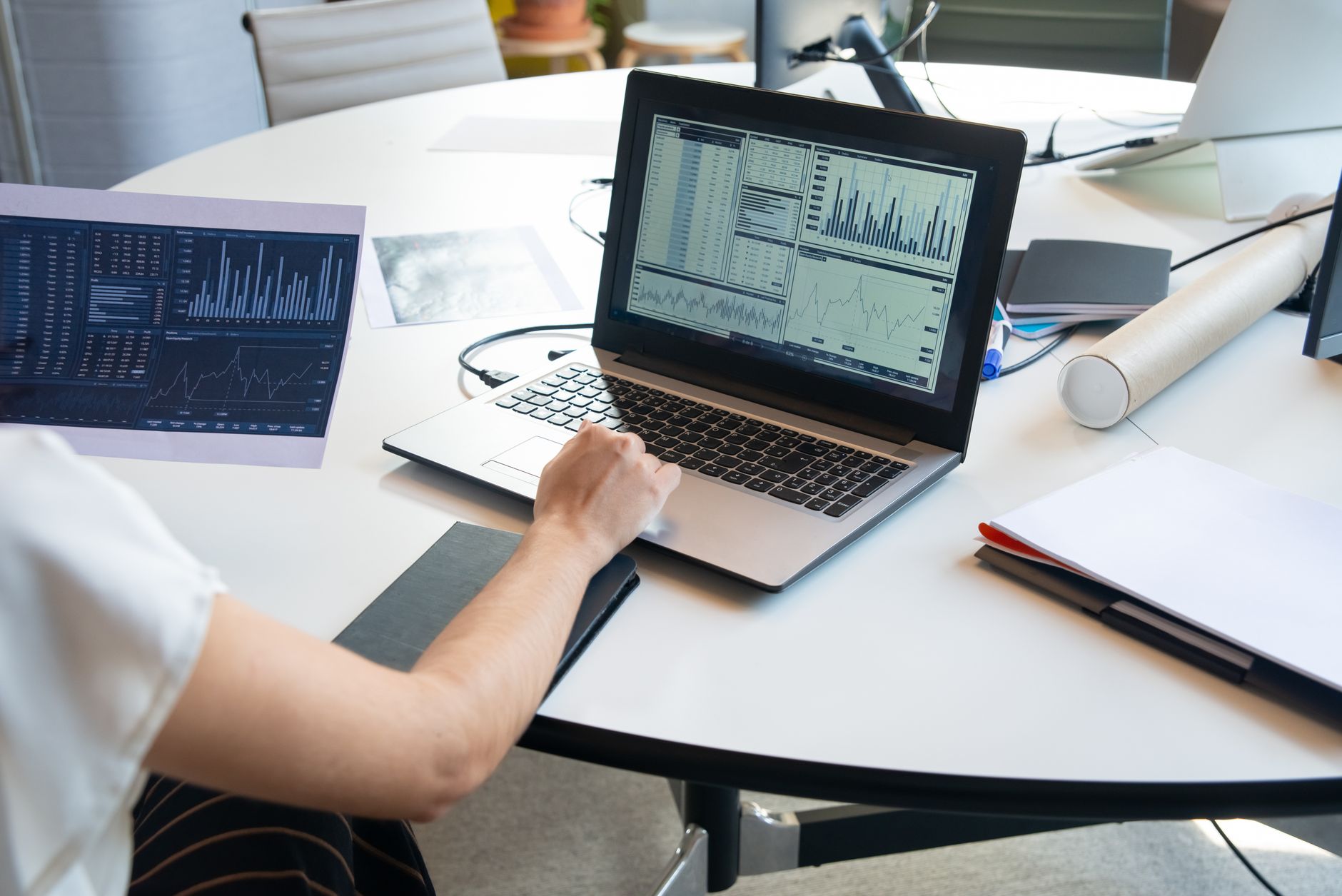 Professional reviewing structured information on an analytics dashboard